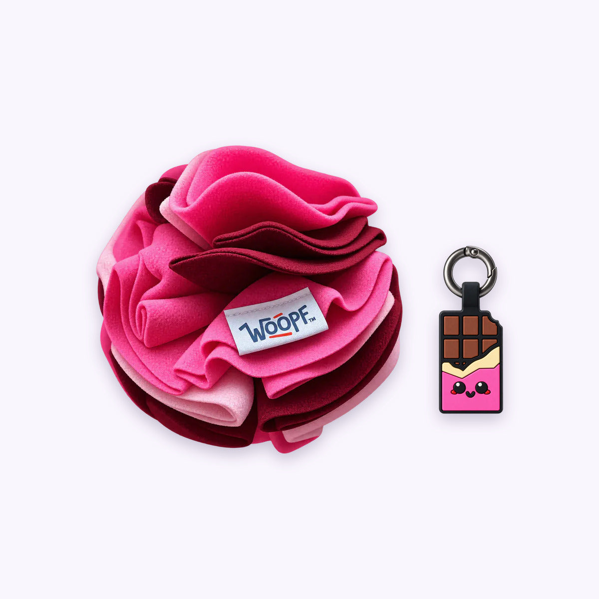 Pink | Tag & Sniff Bundle: The Pink Snuffle Ball with the Chocolate Pink Smart ID Tag on a pale lavender background