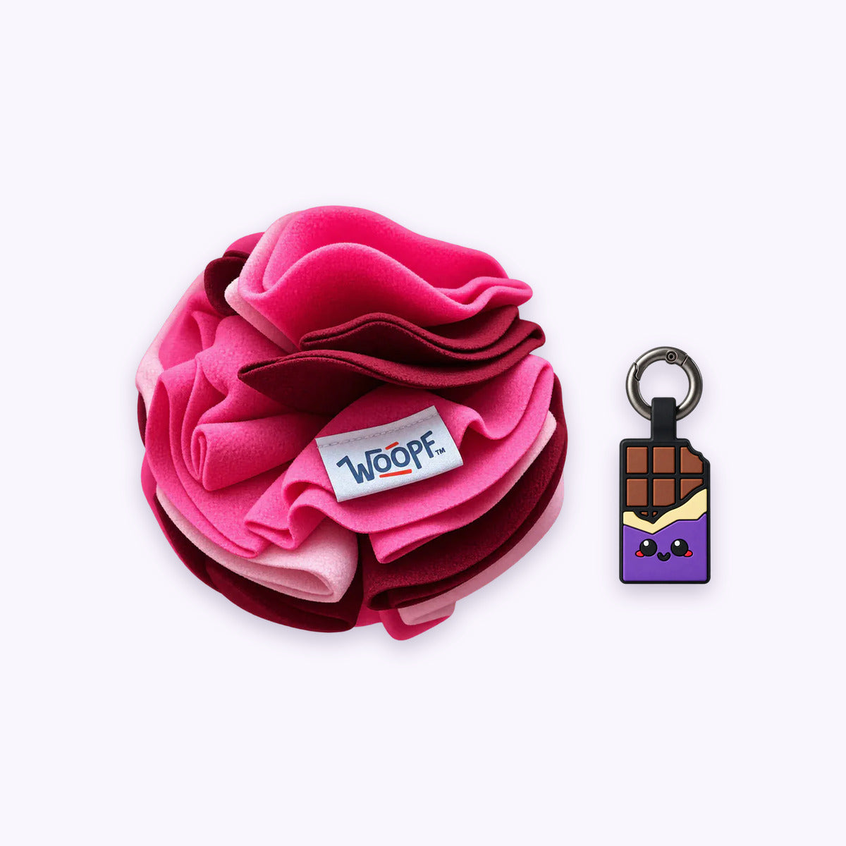 Pink | Tag & Sniff Bundle: The Pink Snuffle Ball with the Chocolate Purple Smart ID Tag on a pale lavender background
