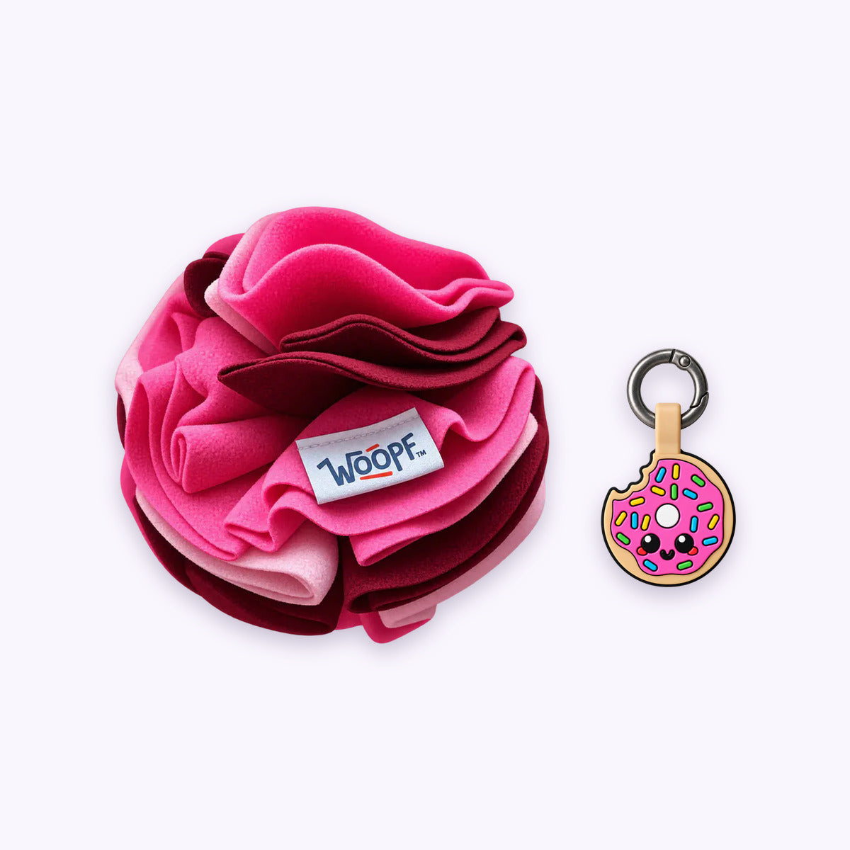 Pink | Tag & Sniff Bundle: The Pink Snuffle Ball with the Donut Smart ID Tag on a pale lavender background
