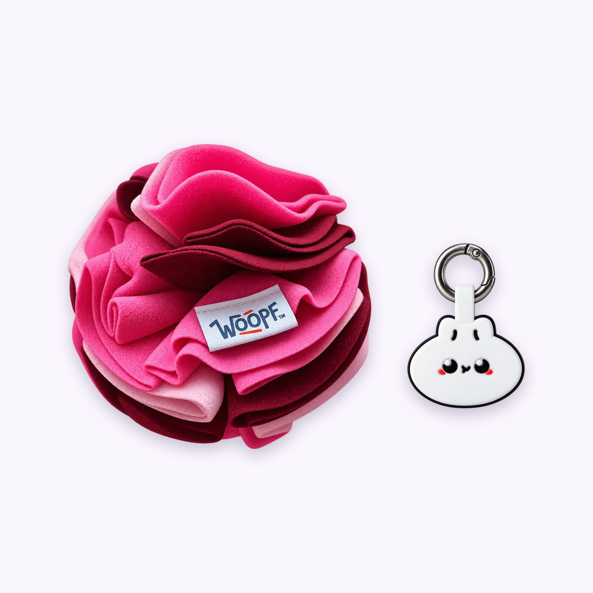 Pink | Tag & Sniff Bundle: The Pink Snuffle Ball with the Dumpling Smart ID Tag on a pale lavender background