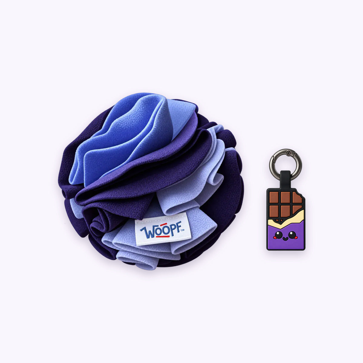 Purple | Tag & Sniff Bundle: The Purple Snuffle Ball with the Chocolate Purple Smart ID Tag on a pale lavender background