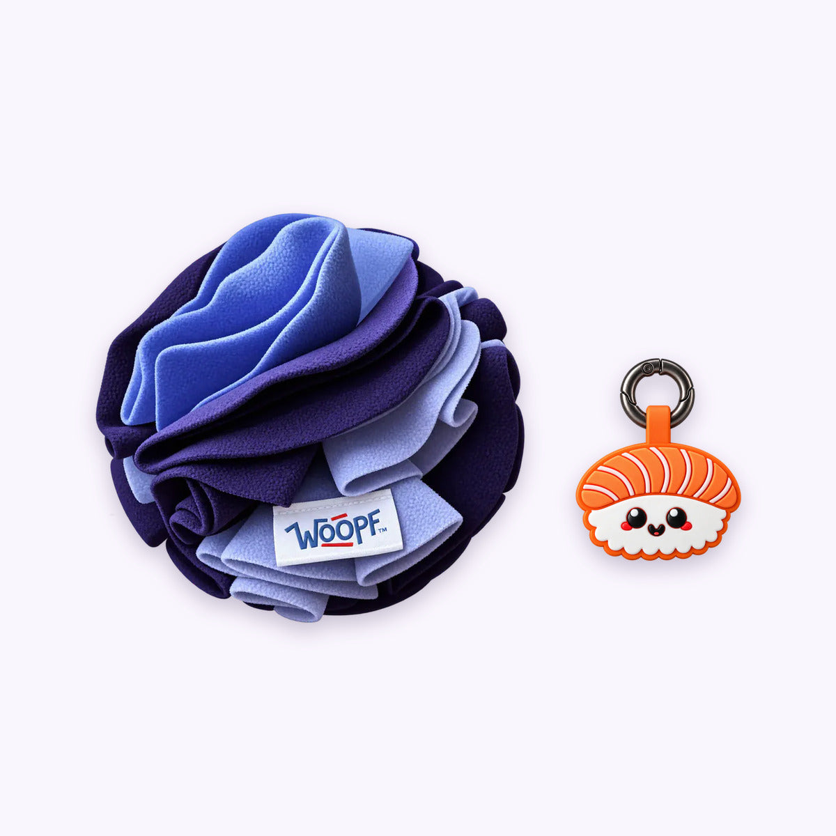 Purple | Tag & Sniff Bundle: The Purple Snuffle Ball with the Salmon Sushi Smart ID Tag on a pale lavender background