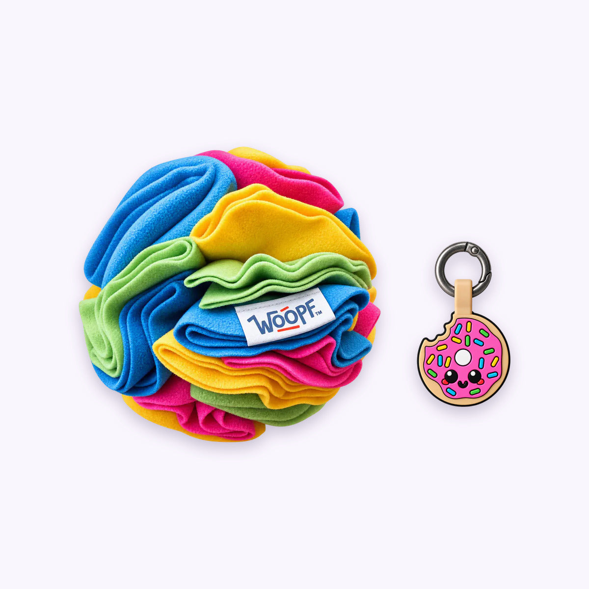 Rainbow | Tag & Sniff Bundle: The Rainbow Snuffle Ball with the Donut Smart ID Tag on a pale lavender background