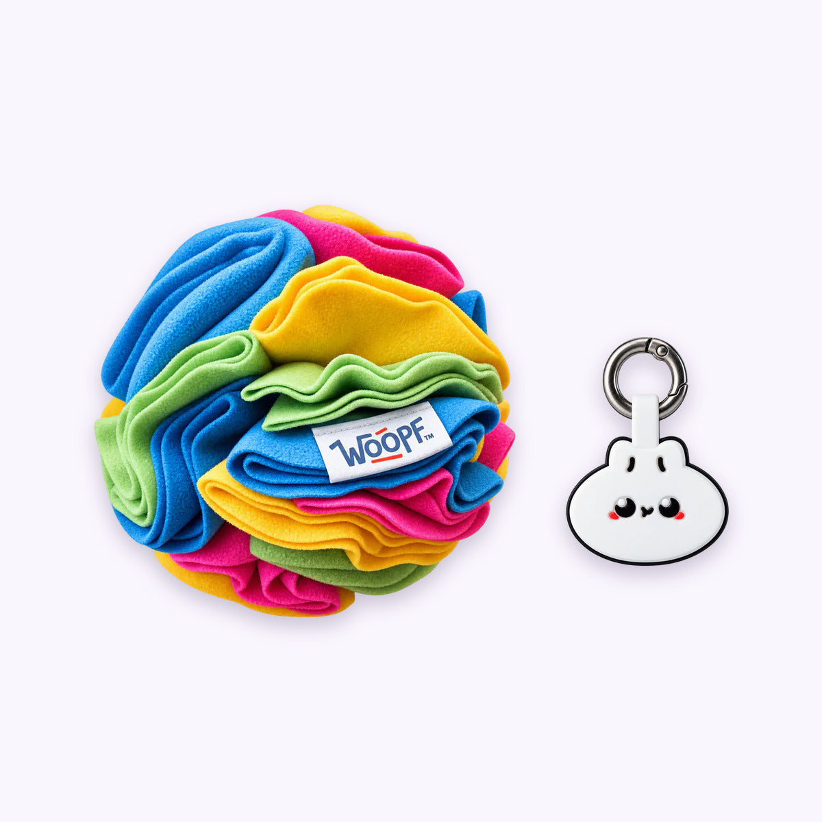 Rainbow | Tag & Sniff Bundle: The Rainbow Snuffle Ball with the Dumpling Smart ID Tag on a pale lavender background