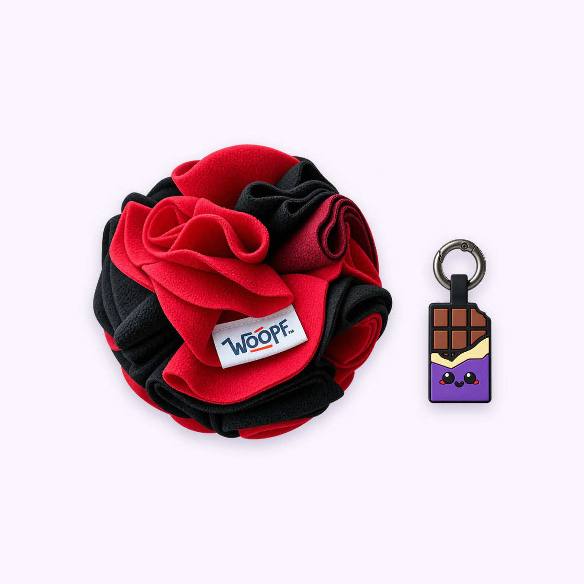 Red | Tag & Sniff Bundle: The Red Snuffle Ball with the Chocolate Purple Smart ID Tag on a pale lavender background
