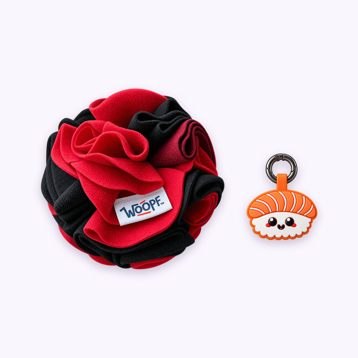 Red | Tag & Sniff Bundle: The Red Snuffle Ball with the Salmon Sushi Smart ID Tag on a pale lavender background
