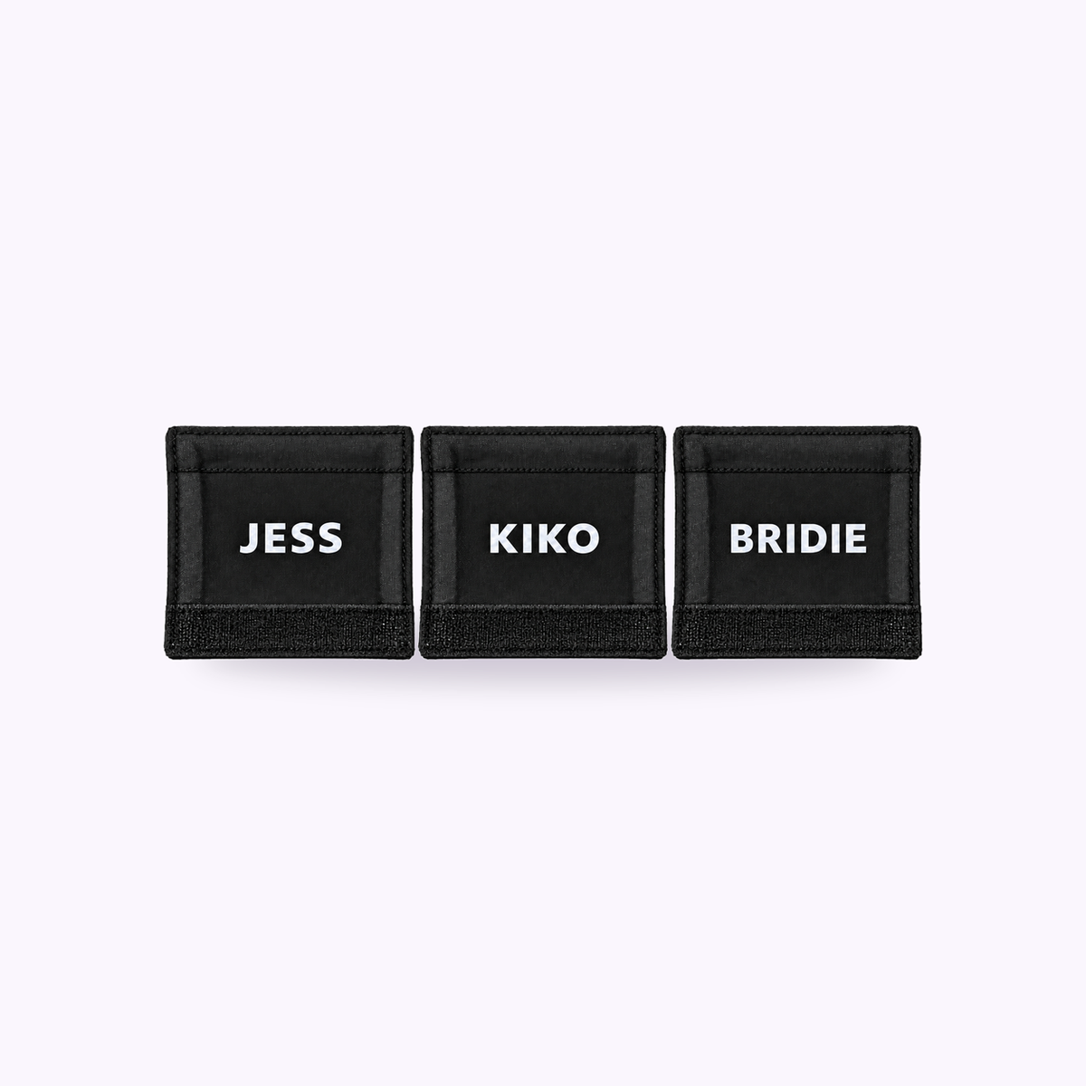 Custom Name Badge Velcro 2 Pack - Three black name badges reading JESS, KIKO and BRIDIE