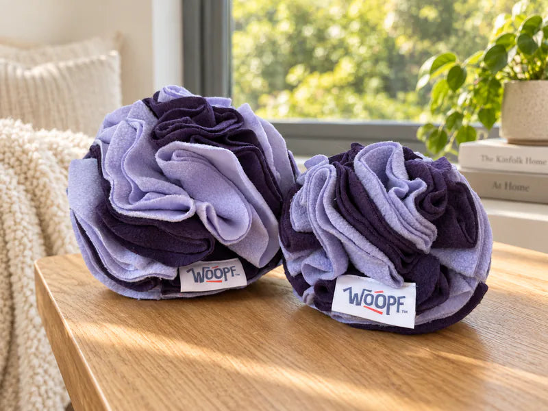Purple Snuffle Balls in Large and Medium on a wooden table